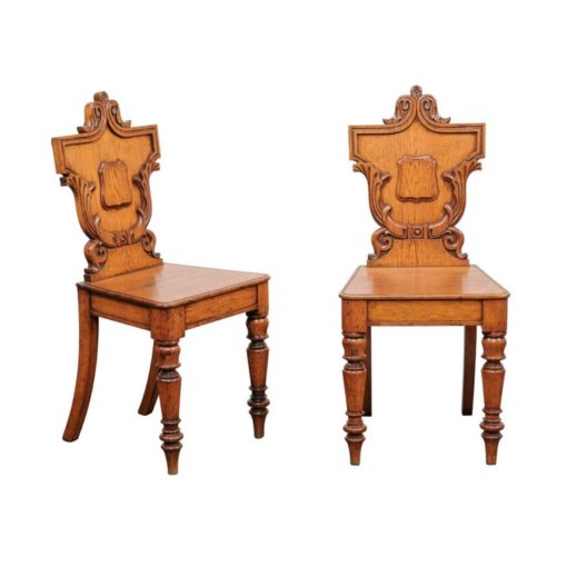 Pair of English Oak Hall Chairs with Carved Shield Backs and Cartouches, 1890s